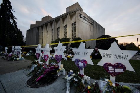 FILE - In this Oct. 29, 2018 file photo, a makeshift memorial stands outside the Tree of Life Synagogue in the aftermath of a deadly shooting at the in Pittsburgh. Organizers have strived to offer emotional support during the second anniversary commemorations. One-on-one counseling will be offered virtually, and theres a tent set up near the synagogue where people can access in-person support from humans and comfort dogs. (AP Photo/Matt Rourke, File)