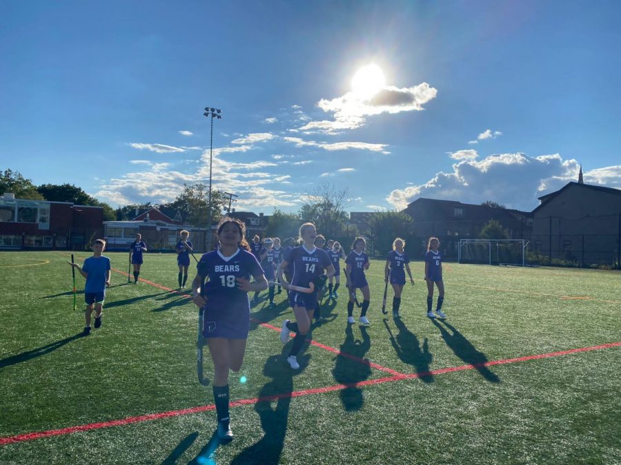 Girls Field Hockey team takes the field before a game (Photo via Sage Grodin)