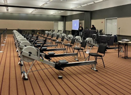 Image of the rowing machines lined up before the races, Source: @3riversrowing Instagram.
